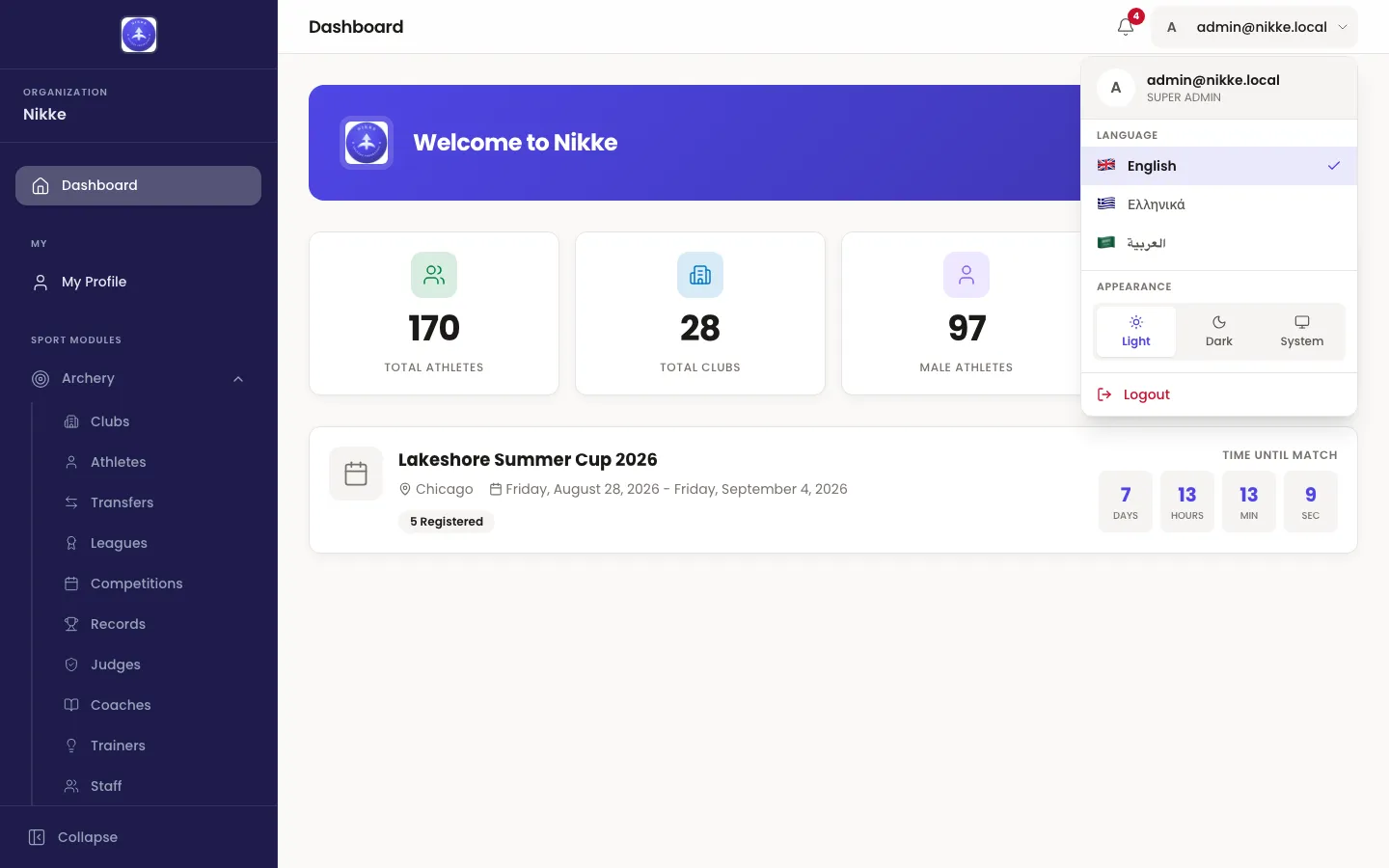 The Velos account menu open over the dashboard, showing the signed-in email address with the account type beneath it, a Language section listing English, Greek and Arabic, an Appearance section with Light, Dark and System, and a Logout item.