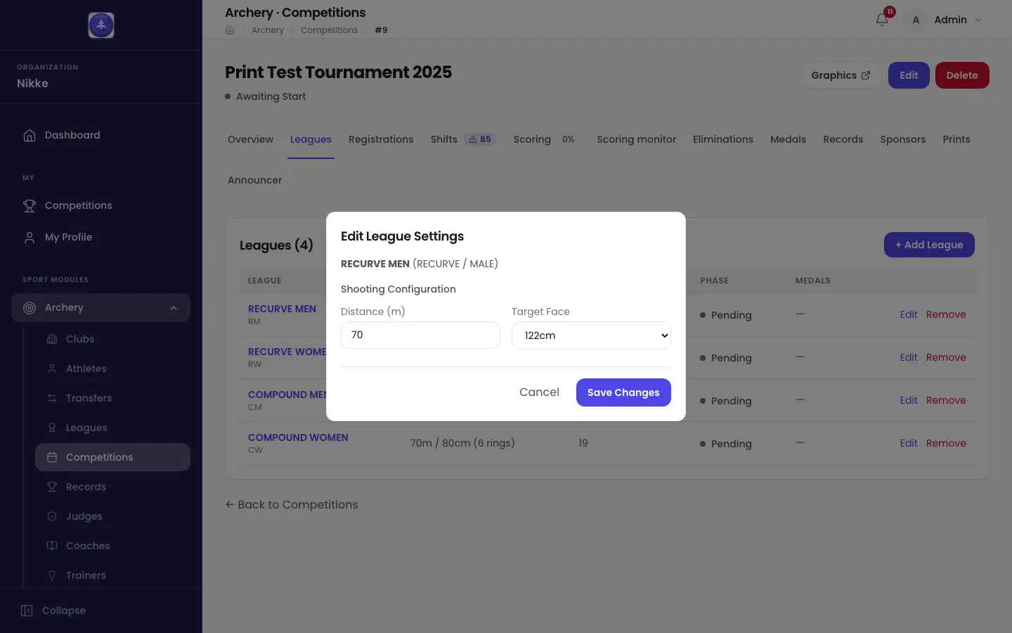 The Edit League Settings dialog over the Leagues tab of a draft competition in Velos. It names the league being edited — RECURVE MEN (RECURVE / MALE) — and under a Shooting Configuration heading holds a Distance (m) field reading 70 and a Target Face dropdown reading 122cm, with Cancel and Save Changes underneath. The table behind it lists four leagues, every one of them Pending, each row ending in Edit and Remove.