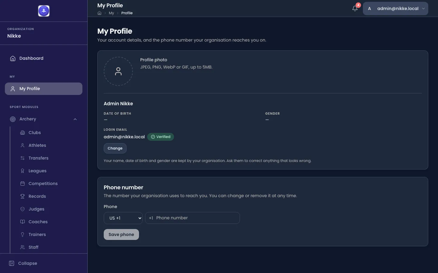 The My Profile page in Velos: a profile photo area, the person's name with date of birth and gender, the login email address marked Verified with a Change button, and a Phone number section with a country selector and a Save phone button.