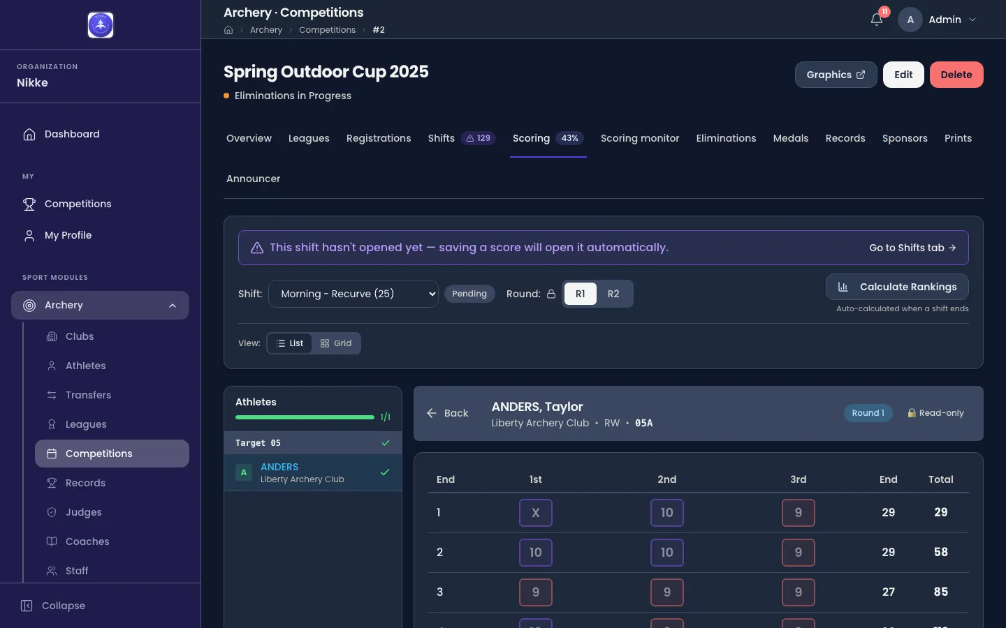 An archer's qualification card open in Velos. A header reads ANDERS, Taylor — Liberty Archery Club · RW · 005A — with a Round 1 badge. A table follows with a row per end and columns for the 1st, 2nd and 3rd arrow, the end total and the running total: end 1 is X, 10, 9 for 29 and 29; end 2 is 10, 10, 9 for 29 and 58; end 3 is 9, 9, 9 for 27 and 85.