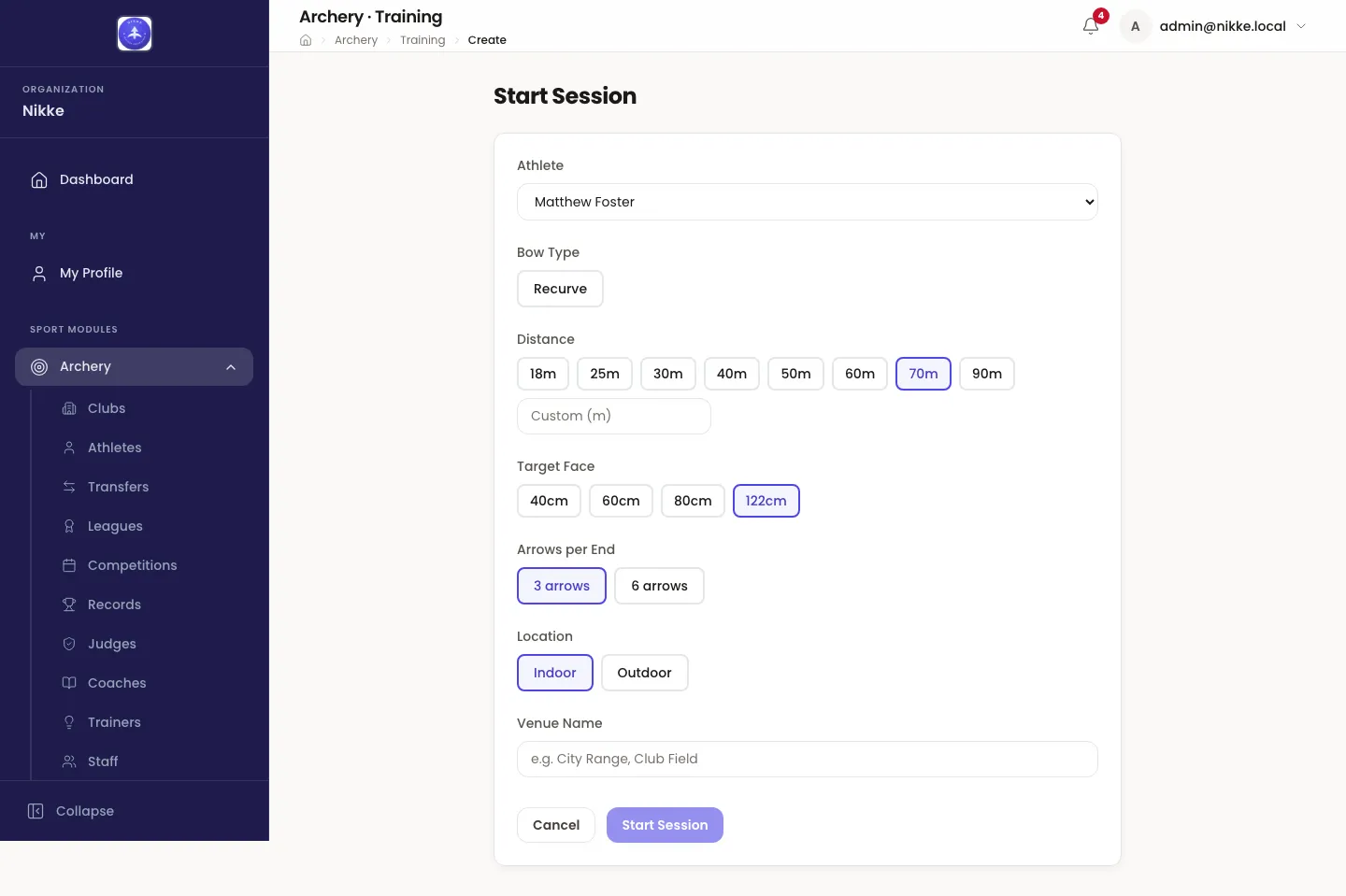 The Start Session form in Velos. An Athlete dropdown reads Matthew Foster; under it a Bow Type row with a single Recurve chip, a Distance row of chips from 18m to 90m with 70m selected and a Custom (m) box under it, a Target Face row with 122cm selected, an Arrows per End row with 3 arrows selected, a Location row with Indoor and Outdoor, and a Venue Name box. Cancel and Start Session buttons sit at the bottom.